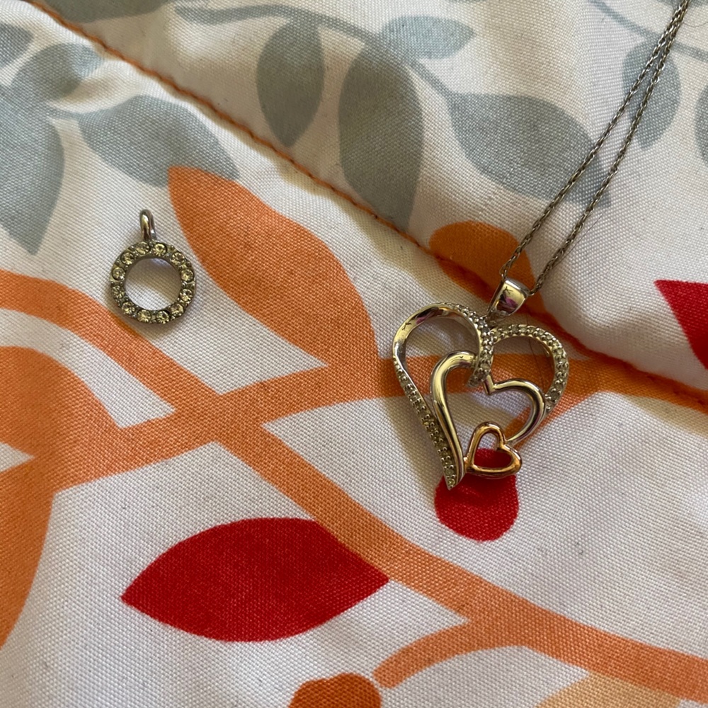 Brand new necklace with 2 charms